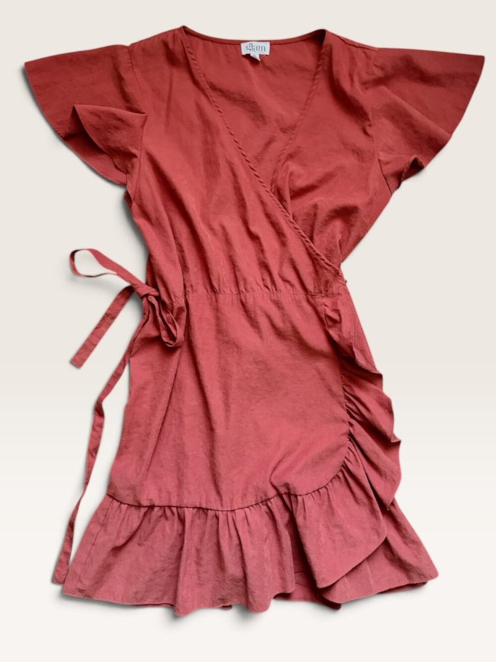 Wrap mini dress with ruffle details.